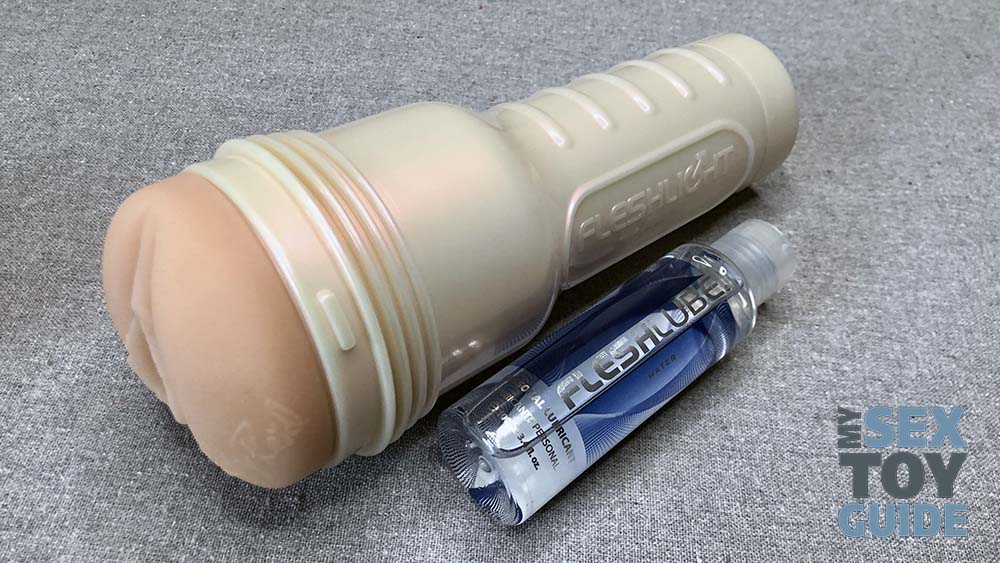 A Fleshlight Girl with a bottle of water-based lubricant