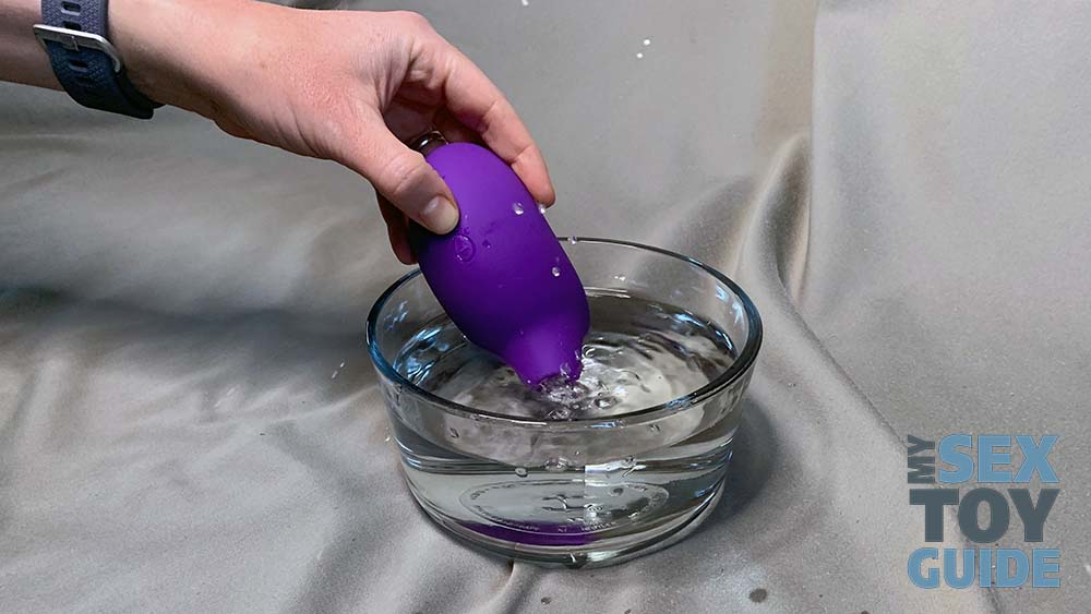 Using the sex toy in a bowl of water