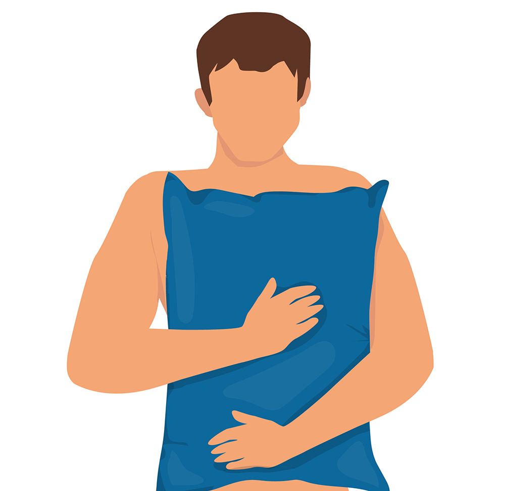 A man hugging a pillow