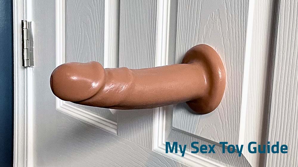 A suction dildo mounted on a door