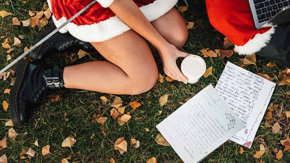 A couple wearing sexy Santa outfits