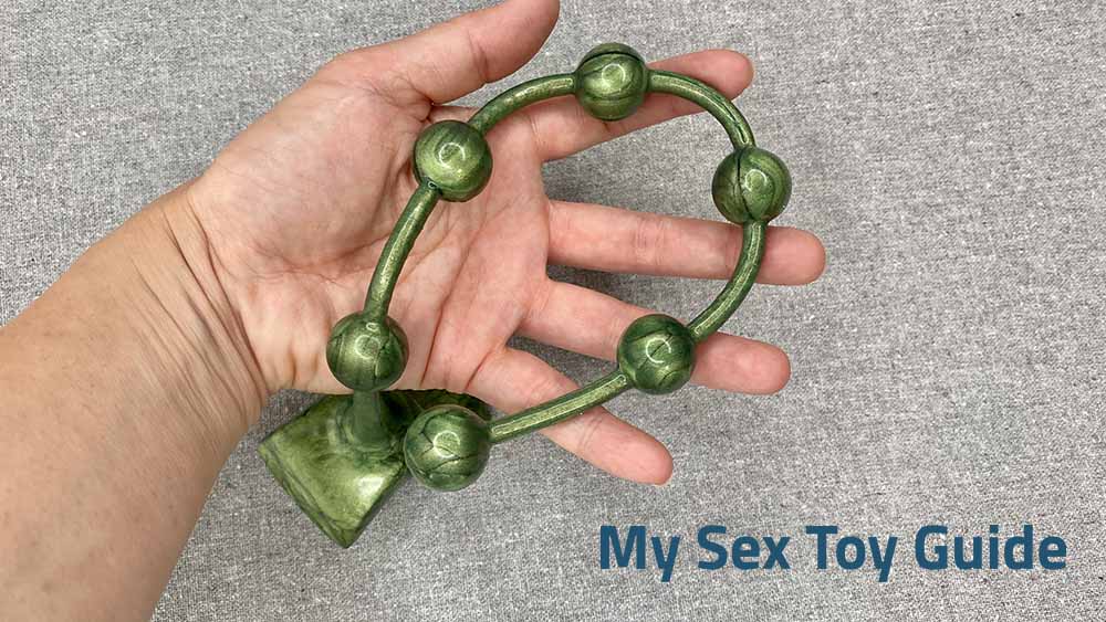 Me holding the Emerald Gemstones Silicone Anal Beads