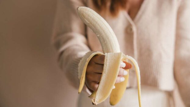 Woman holding a banana