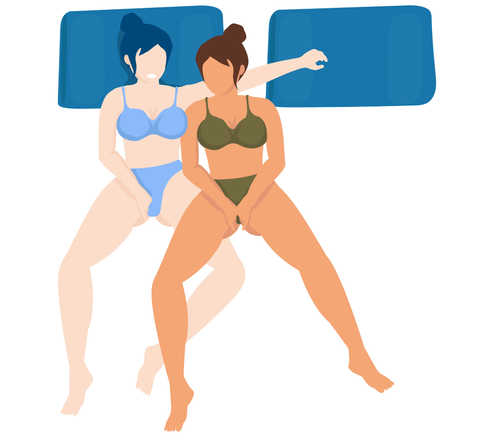 Two women masturbating together