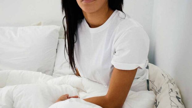 A woman sitting in bed