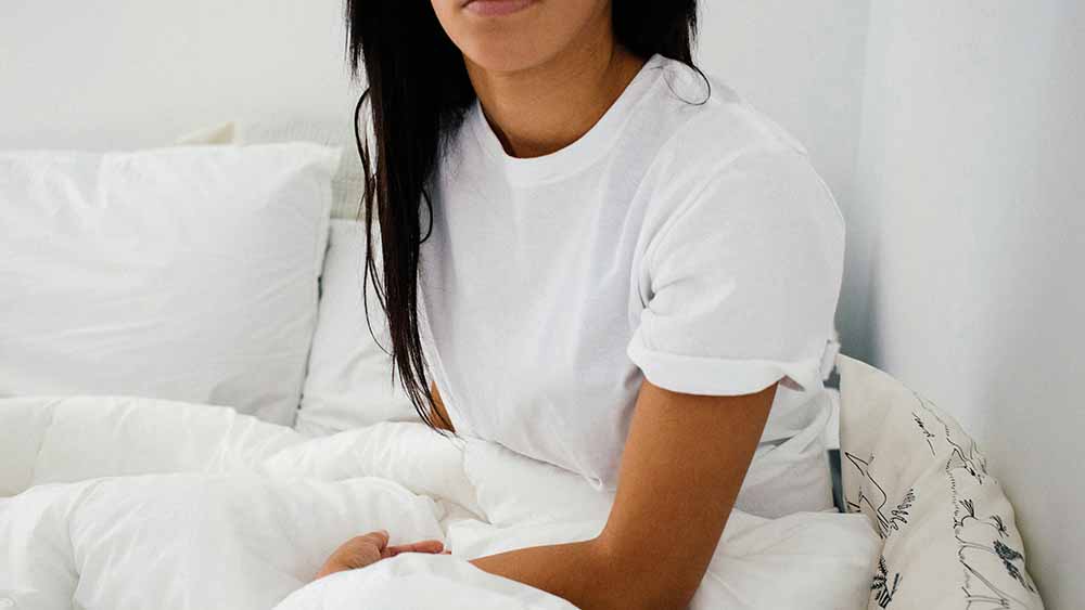 A woman sitting in bed
