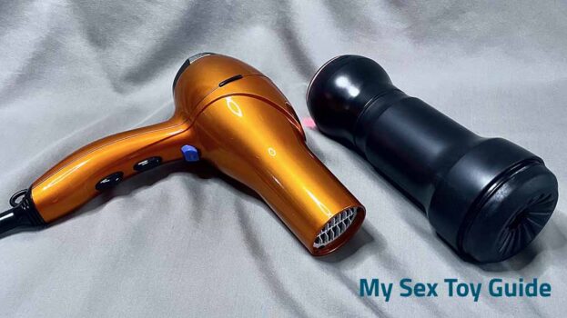 KIIROO Feel Pocket Stroker next to a hairdryer as size reference