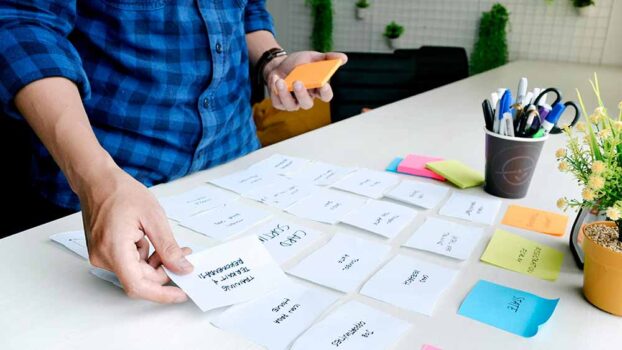 A man brainstorming ideas for a sex toy development process