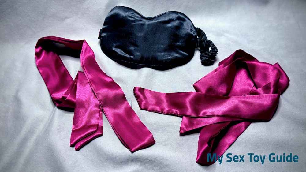The blindfold and satin restraints