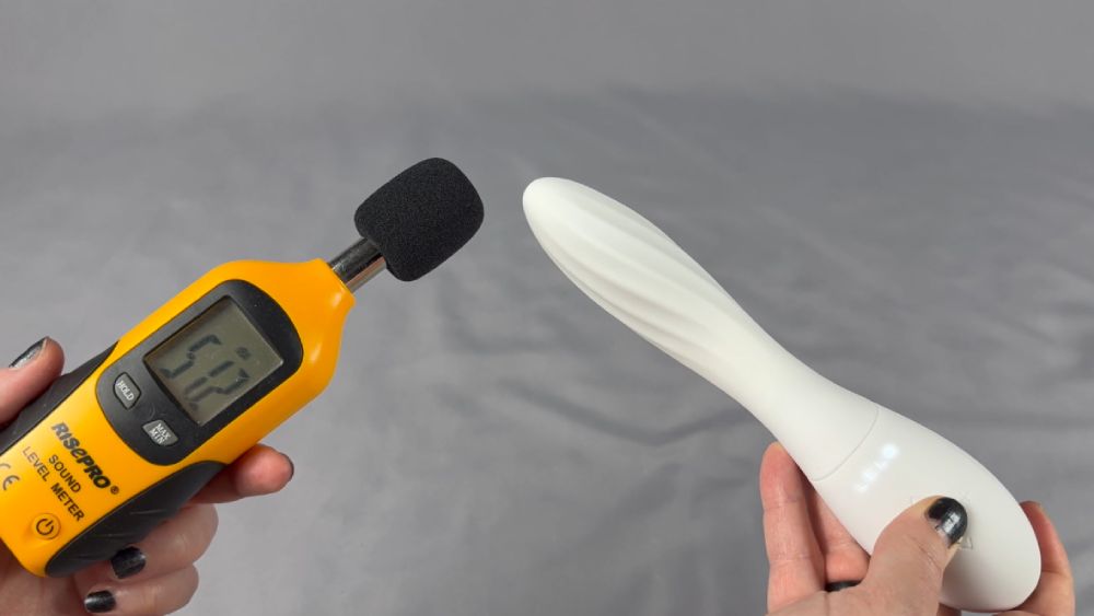 Me testing the sound level using a decibel meter